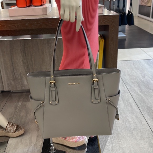 Voyager Small Saffiano Leather Tote Bag
Style# 30H1GV6T4T
NWT
COLOR: Pearl Gray - Picture 7 of 16